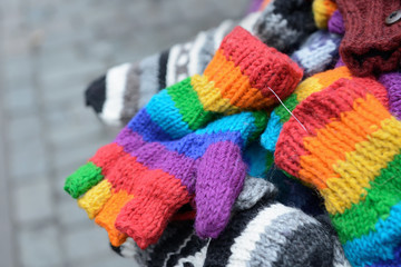 Knitted mittens and gloves on Christmas market