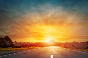 Sunrise above road