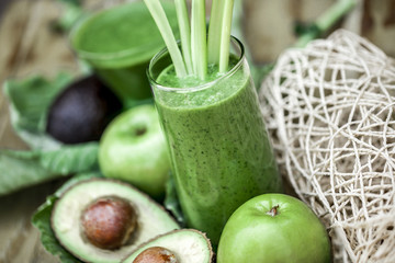 Green smoothie with fresh fruit  and vegetables.