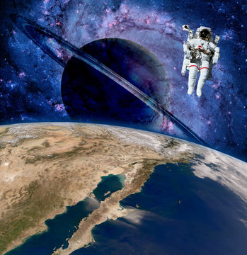 Earth astronaut planet outer space saturn spaceman cosmonaut. Elements of this image furnished by NASA.