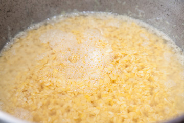 Closeup of bulgur under water with selective focus