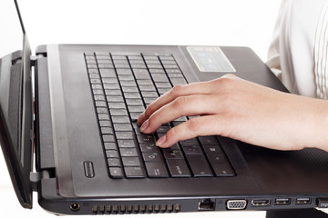 Woman's fingers on keyboard