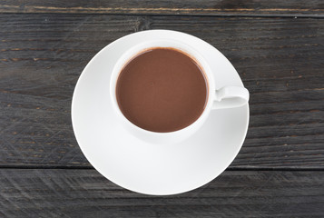 a cup of chocolate on wood table