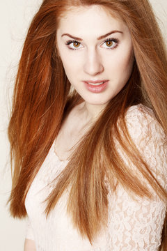 Portrait of amazinly beautiful young redhead woman