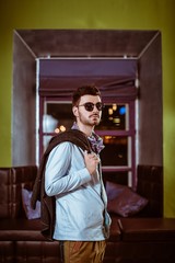 Young stylish sexy handsome model man in casual cloth lifestyle in glasses.