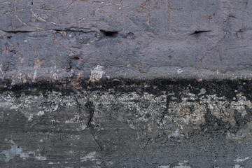 Aged grunge abstract concrete texture with dents and cracked