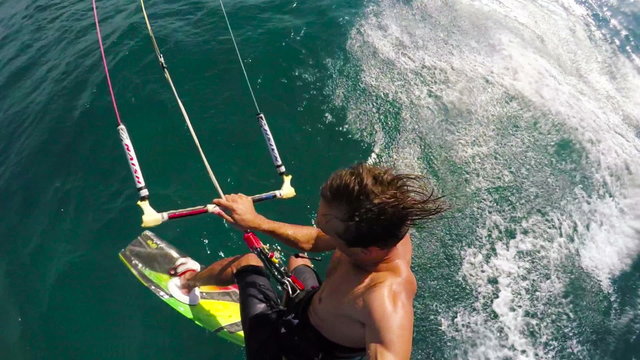 Young Man Kitesurfing in Ocean Catches Big Air. Slow Motion HD POV Shot.