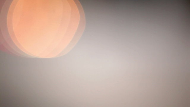 Unfocused camera lenses create beautiful bokeh of the traffic lights