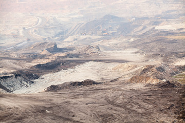 Part of a pit with big mining truck working