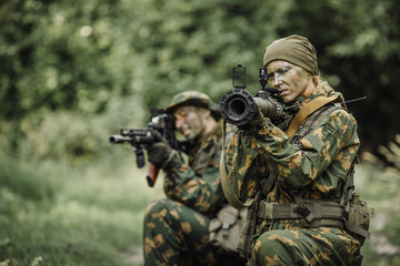 Group of soldiers special forces during the raid in the forest
