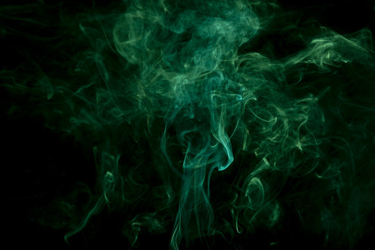 Movement of white smoke on black background