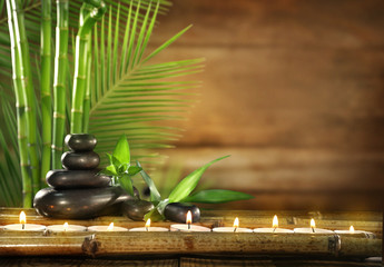 Spa stones, candles on wooden background © Africa Studio