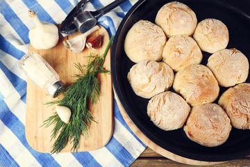 Fresh homemade bread buns on table, close-up