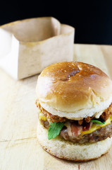 Delicious hamburger with a juicy pork patty and bacon