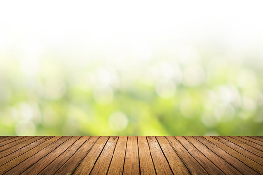 wooden floor with green nature blurred background