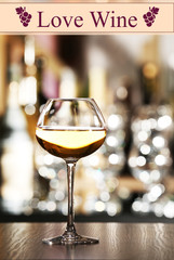 Wineglass on table in bar