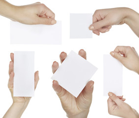 Obraz premium Hands holding blank cards isolated on white