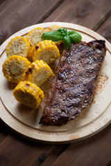 Grilled black angus steak striploin served with sweet corn