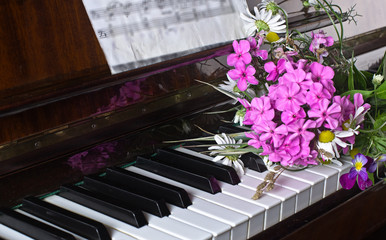 bouquet of summer flowers on a piano