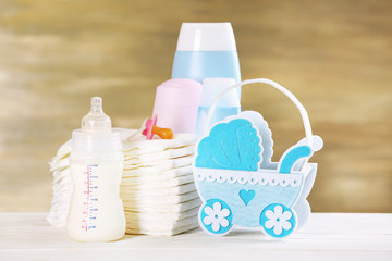 Baby accessories on table on grey background
