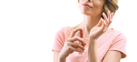 Beautiful young woman with perfume bottle isolate on white