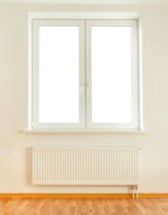 White plastic double window and radiator