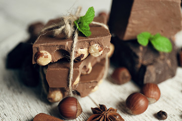Set of chocolate on wooden table, closeup