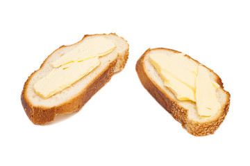 two slices of wheaten bread spreaded with butter