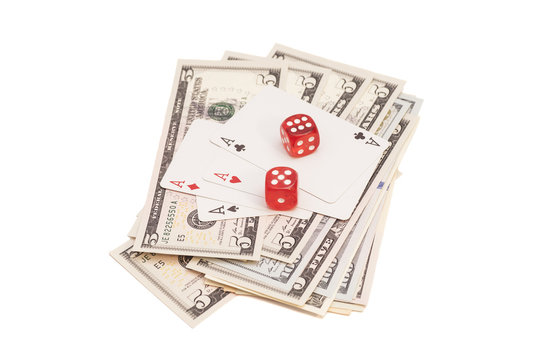  red dice with four aces and dollars