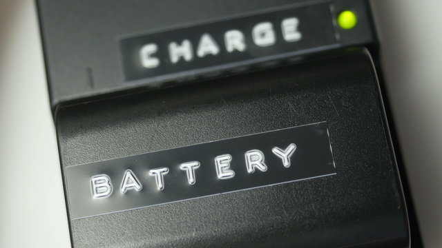 Close up of installing a battery into a charger