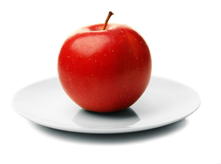 Apple on saucer isolated on white