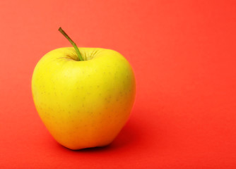 Apple on color background