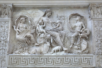 Fototapeta na wymiar Relief of female Goddess with Twins on the Ara Pacis (Altar of Augustan Peace) in Rome, Italy