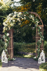 wedding arch in forest - 87785198