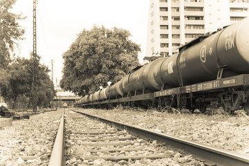 tone black and writeRailroad train of tanker cars transporting crude oil on the tracks.