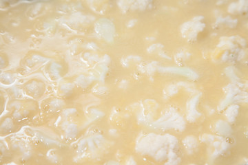 Closeup of cut cauliflower in stainless steel bowl