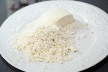 Closeup of grated paneer cheese with selective focus