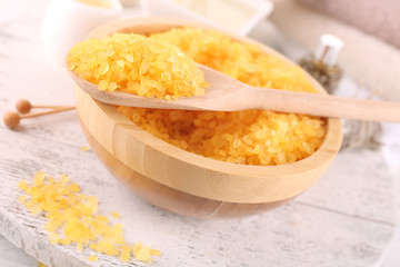 Spa still life with color sea salt on wooden table, closeup