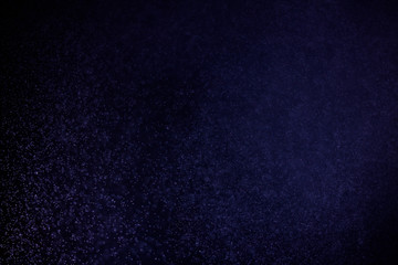 abstract dark bokhe lights background , purple,black and subtle gold. defocused background
