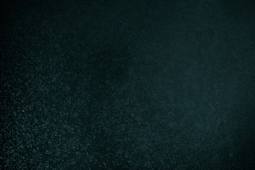 abstract dark bokhe lights background , purple,black and subtle gold. defocused background