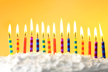 Birthday cake with candles on color background