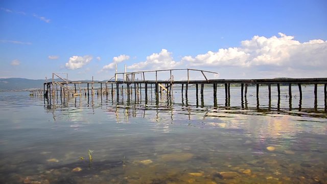 Wooden Beach Pier with water reflection