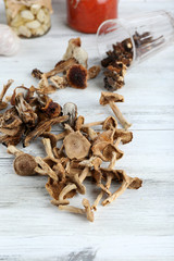 Dried mushrooms on wooden background