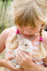 girl with young bunny rabbit © katarinagondova