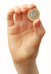 Plakat Female hand with coin isolated on white