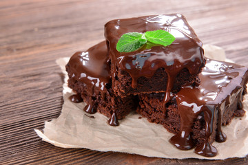 Delicious chocolate cakes on table close-up