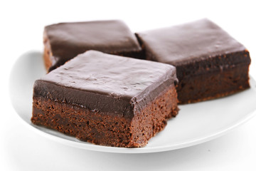 Delicious chocolate cake on plate close-up
