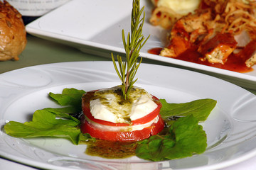 Caprese salad with tomatoes, mozzarella and basil.