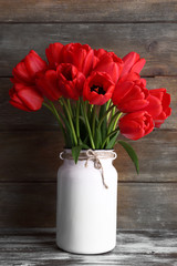 Beautiful tulips on wooden background