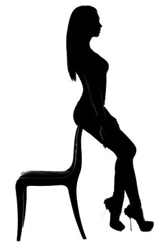 Silhouette of a woman sitting on the chair